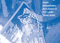 Israeli demonstrators burn posters of PLO Leader Yasser Arafat