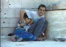 7-2-08-dura-and-father-staged WAS IT STAGED? Mohammed al-Dura and his father