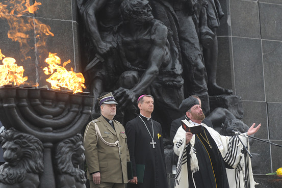 Cantor Joseph Malovany, right, sings during prayers in front of the Warsaw Ghetto Uprising memorial in Warsaw, April 19, 2013.