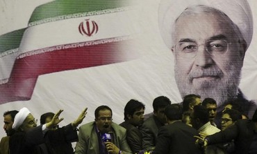 Then-candidate for Iranian president Hassan Rohani (L) waves to supporters Photo: REUTERS