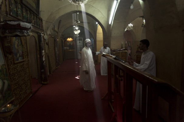 (Manu Brabo/ Associated Press ) - In this Wednesday, Nov. 13, 2013 photo, Coptic monks and altar boys worship in Mar Girgis, or St. George, Monastery, south of the ancient city of Luxor, Egypt. The week-long festival of Mar Girgis, has been held in Luxor annually for more than a century, attracting as many as 2 million pilgrims from across Egypt to one of the biggest and most exuberant events of the year for Orthodox Coptic Christians. This year, however, the government canceled the festival, fearing it would be a target for Islamic militants.
