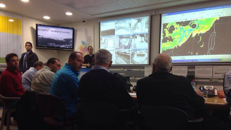 Prime Minister Benjamin Netanyahu, center right, assesses the new storm with Jerusalem Mayor Nir Barkat, in the Jerusalem situation room (photo credit: @LTCPeterLerner/Twitter)