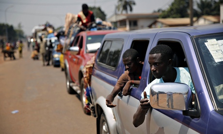 A convoy of more than 100 vehicles carrying Muslims trying to flee Bangui. Photograph: Jerome Delay/AP
