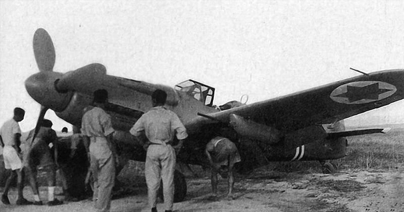 Soldiers inspect one of the Israeli Air Force's new fighter planes purchased from Czechoslovakia in 1948.