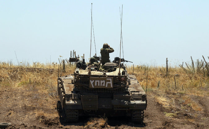 An Israeli tank took position on the Israeli-Syrian border Sunday after a youth was killed. Credit Atef Safadi/European Pressphoto Agency