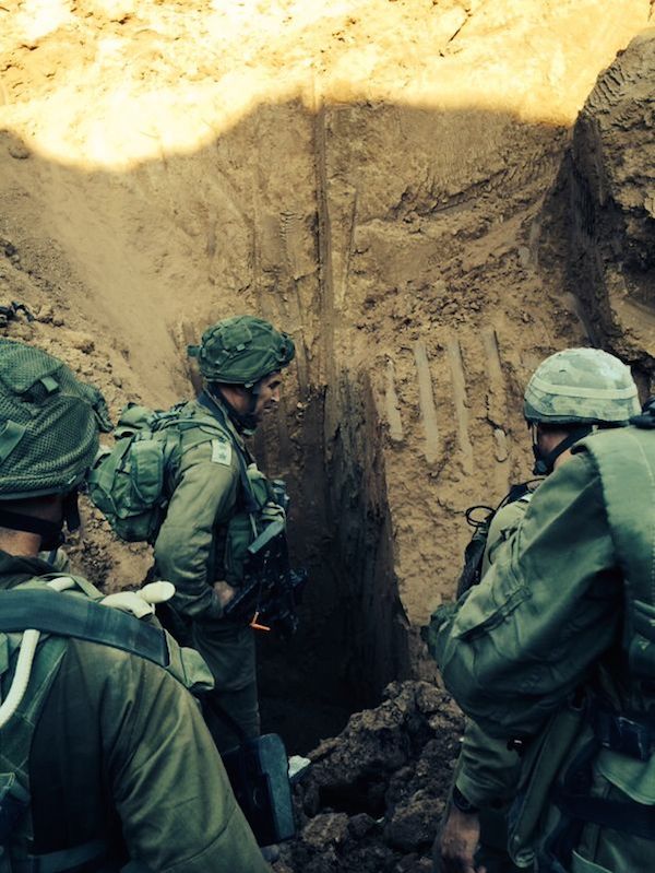 During Operation Protective Edge, Israeli soldiers seen at the entrance to a Hamas terror tunnel found near the Erez border crossing into the Gaza Strip. Credit: IDF Spokesperson/Flash90.