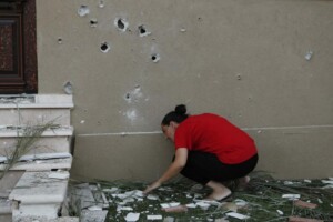 A woman surveys the damage after a rocket fired by Palestinian militants in Gaza landed in Israel's southern town of Kiryat Gat July 31, 2014. | Siegfried Modola / Reuters