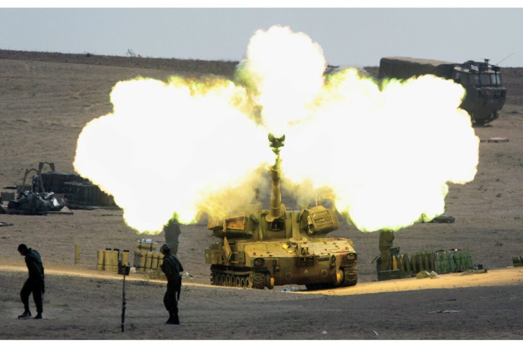 An Israeli 155 mm artillery piece is fired into the Gaza Strip from a base in southern Israel, on July 31, 2014. Since 2008, Israel and the Islamist militant group Hamas have fought three bitter conflicts.