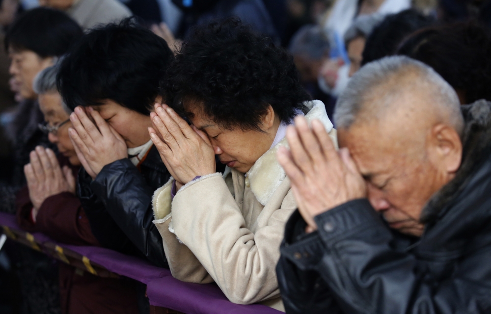 Believers take part in a weekend mass at an underground Catholic church in Tianjin. (PHOTO: REUTERS/KIM KYUNG-HOON)