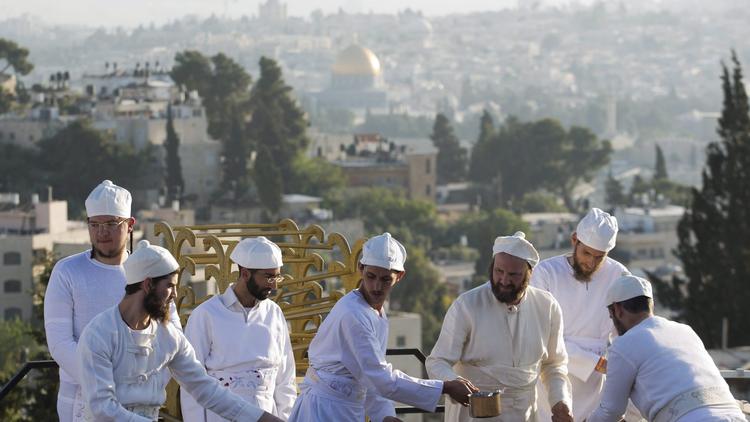 Orthodox Jews from the Temple Mount Institute dressed like priests participate in the reenactment of the Passover sacrifice ceremony in Mount of Olives near Jerusalem, on April 18, 2016. (Abir Sultan / European Pressphoto Agency)