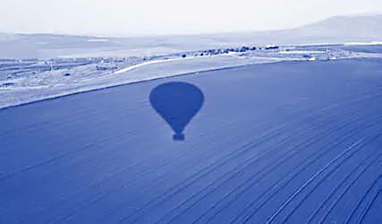 View from hot air balloon with balloon shadow