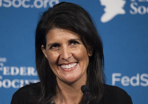 FILE - In this Friday, Nov. 18, 2016 photo, South Carolina Gov. Nikki Haley smiles while speaking at the Federalist Society's National Lawyers Convention in Washington. President-elect Donald Trump has chosen Haley as U.S. ambassador to the United Nations, and he will treat the ambassadorship as a Cabinet-level position, according to two sources familiar with Trump's decision who requested anonymity to discuss the decision and its announcement. Haley, an outspoken Trump critic throughout much of the presidential race, would become his first female - and first nonwhite - Cabinet-level official if confirmed by the Senate. (AP Photo/Cliff Owen, File)
